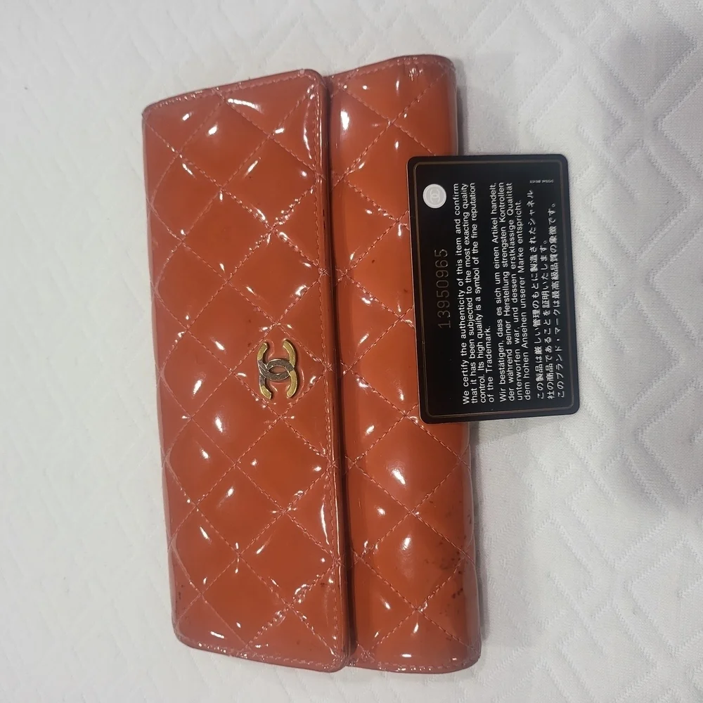 CHANEL Quilted Orange Matelasse Gold CC Logo Patent Leather Long Bifold Wallet.
